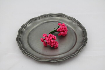old silver plate made of pewter with decoration