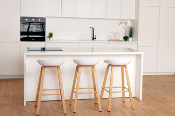 Fototapeta na wymiar interior of a white kitchen in a Scandinavian style. Soft selective focus.