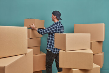 Man arranging boxes at warehouse