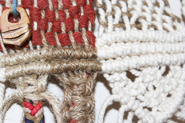Macrame made with blue and white tile colored threads. Macrame in various patterns made with colored threads.