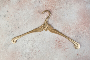 Antique brass clothes hanger