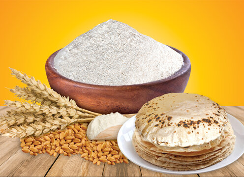 Wheat flour Bunch of wheat ears, dried grains in wooden bowl, flour in wooden bowl on white background. Cereals harvesting, bakery products