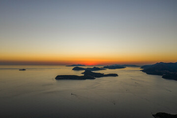 Fototapeta na wymiar Aerial drone shot of post sunset over Adriatic sea vie from Babin Kuk hill in Dubrovnik Croatia summer