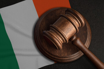Judge gavel and flag of Ireland. Law and justice in Ireland. Violation of rights and freedoms