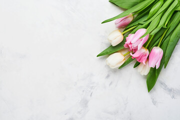 Pink and white tulips on white background. Floral pattern. Greeting card. Mock up. Space for text.