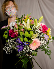 A flourist preparing a bouquet of flowers