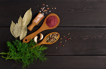 Assortment of spices ,on a woden black background,  top view, horizontal, no peope, 
