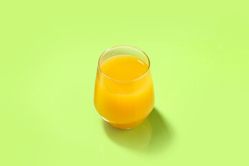 Glass of tasty mango margarita on color background