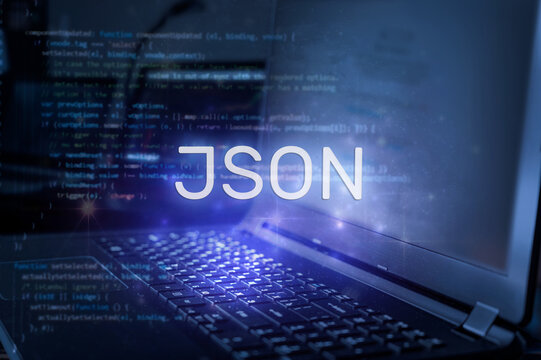 JSON inscription against laptop and code background. Technology concept.