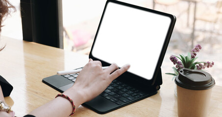 Girl at home uses laptop mockup. Modern technology in everyday life. Blank white screen place for text or template.