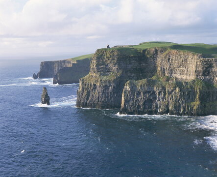 O'Brians tower and Breanan Mor seastack looking from Hag's Head, the Cliffs of Moher, up to 230m high, County Clare, Munster
