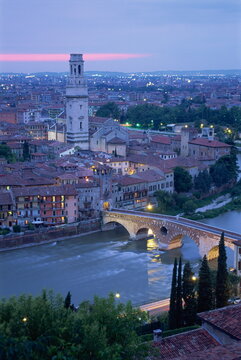 The Ponte Pietra and Anastasia Cathedral at dusk from the Museo Archeologico in the town of Verona, Veneto