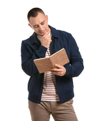 Handsome young man reading book on white background