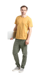 Handsome young man with laptop on white background