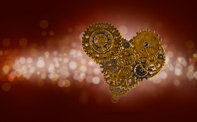 Golden heart made with metallic gears on shiny red background
