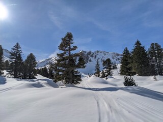 Beautiful ski tour in the Glarus region with a breathtaking view of the snow-covered mountains. Skimo, mountaineering