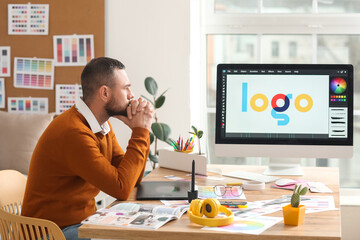 Male designer working in office