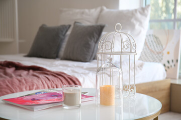 Aroma candles on table in bedroom