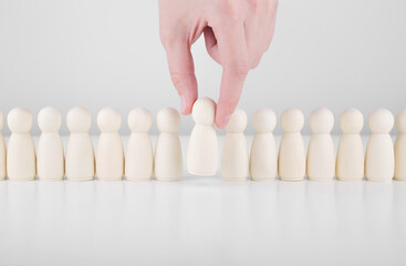 Successful team leader. Businessman hand choose people standing out from the crowd. Human resources and CEO concept
