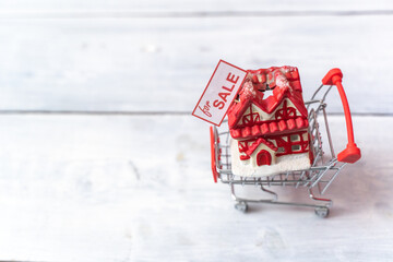 Toy house for sale in small shopping cart