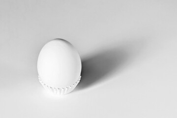 White egg on a white isolated background with shadow. Ingredient.Healthy food.Easter.