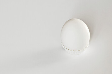 White egg on a white isolated background with shadow. Ingredient.Healthy food.Easter.