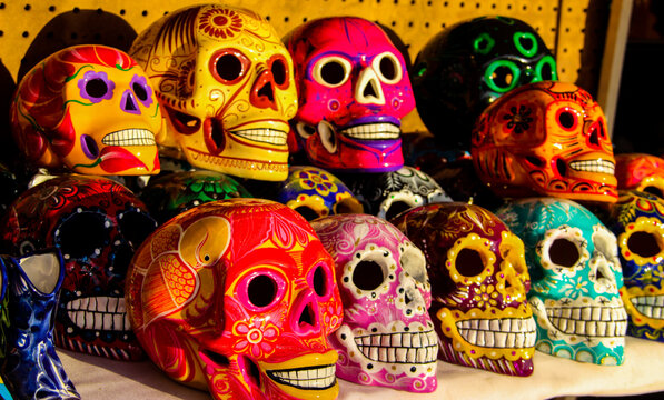 Calacas, wooden skull Day of the Dead masks on market in Cabo San Lucas, Mexico