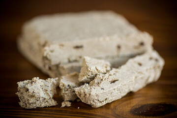 piece of sweet halva on a wooden table