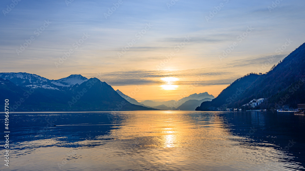 Sticker Sunset over Lake Lucerne. Silhouettes of the Alps mountains.