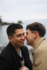 portrait of a homosexual young couple on the beach