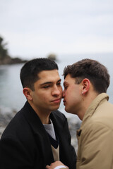 portrait of a homosexual young couple on the beach