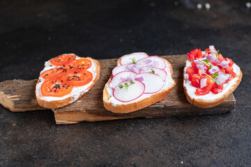 vegetable bruschetta tomato, radish cream cheese on the table cooking meal snack top view copy space food background rustic image 