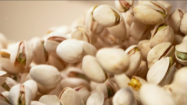 Super slow motion of flying pistachios in rotating movement. Filmed on high speed cinema camera, 1000fps.