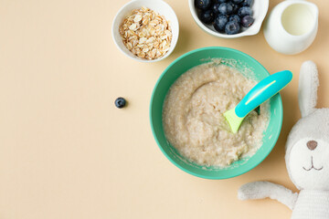 Baby porridge with banana and berries