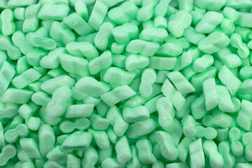 Green Polystyrene Foam Packaging Filler Peanuts Cushioning Material Texture Background
