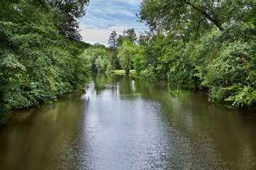 Fototapeta na wymiar river landscape in Geisenheim on a cloudy day, Hesse, Germany