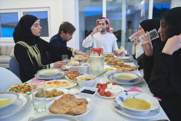 Fototapeta na wymiar Muslim family having iftar together during Ramadan