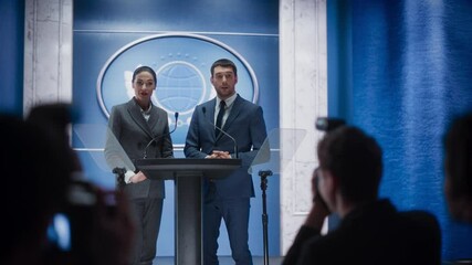 Female and Male Organization Representatives Speaking at Press Conference in Government Building. Press Officers Delivering a Speech at Summit. Ministers Speaking at Congress Hearing.