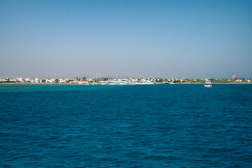 Fototapeta premium Red sea coral reef and blue sky. El Gouna, Egypt