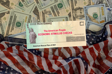 Senate stimulus deal includes individual checks virus economic stimulus plan US 100 dollar bills currency on American flag American Rescue Plan