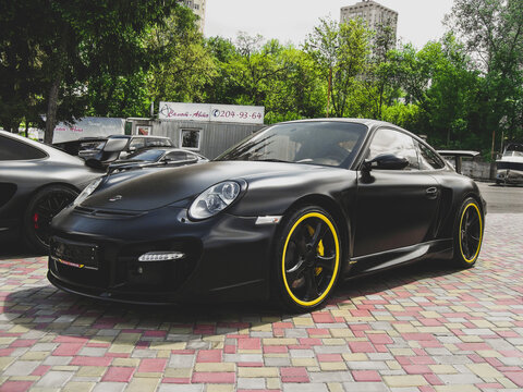 Kiev, Ukraine - May 14, 2011: Black supercar Porsche 911 (997) Turbo TechArt GT Street in the city