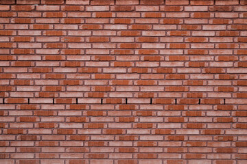 Beautiful new red brick wall with space for text, background with even surface, for template no person