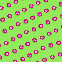 Pattern of purple flowers on green background. Creative wallpaper.