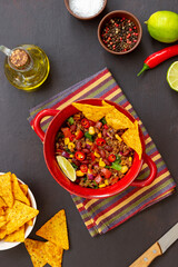 Chili con carne with nachos chips. Mexican food. National cuisine.