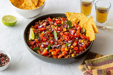 Chili con carne with nachos chips. Mexican food. National cuisine.