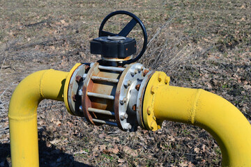 Gas pipeline yellow pipe and large flanged valve.