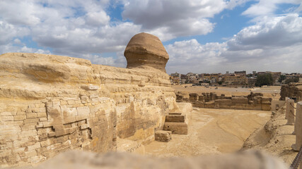 The sphinx looks upon town.