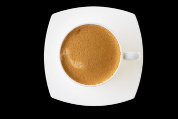 Close up top view of brewed cup coffee isolated on black background. Food and drinks concept.