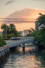 sunset over the river bridge Miami Beach florida sky palms car sunrise reflection 