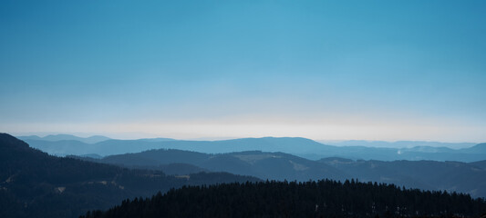Naklejka na ściany i meble Amazing panorama background banner long from a fog landscape in the morning in black forest 